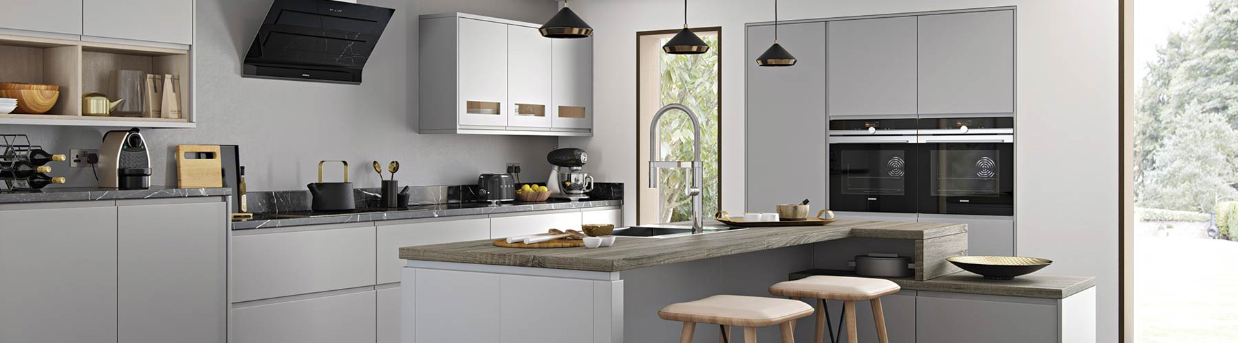 A grey handle-less kitchen with a range of different cupboard styles, island and unique patterned worktops.