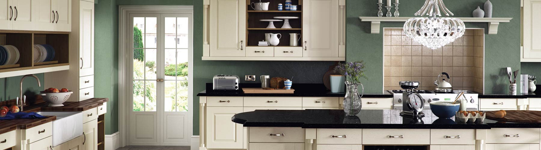 A classic ivory panel kitchen with unique detailing and granite worktops.