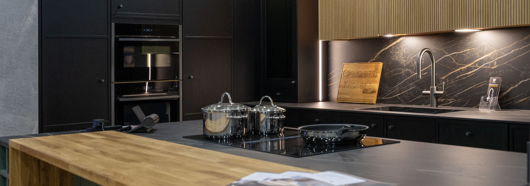 Shaker kitchen with light and dark grey doors on display in our showroom.